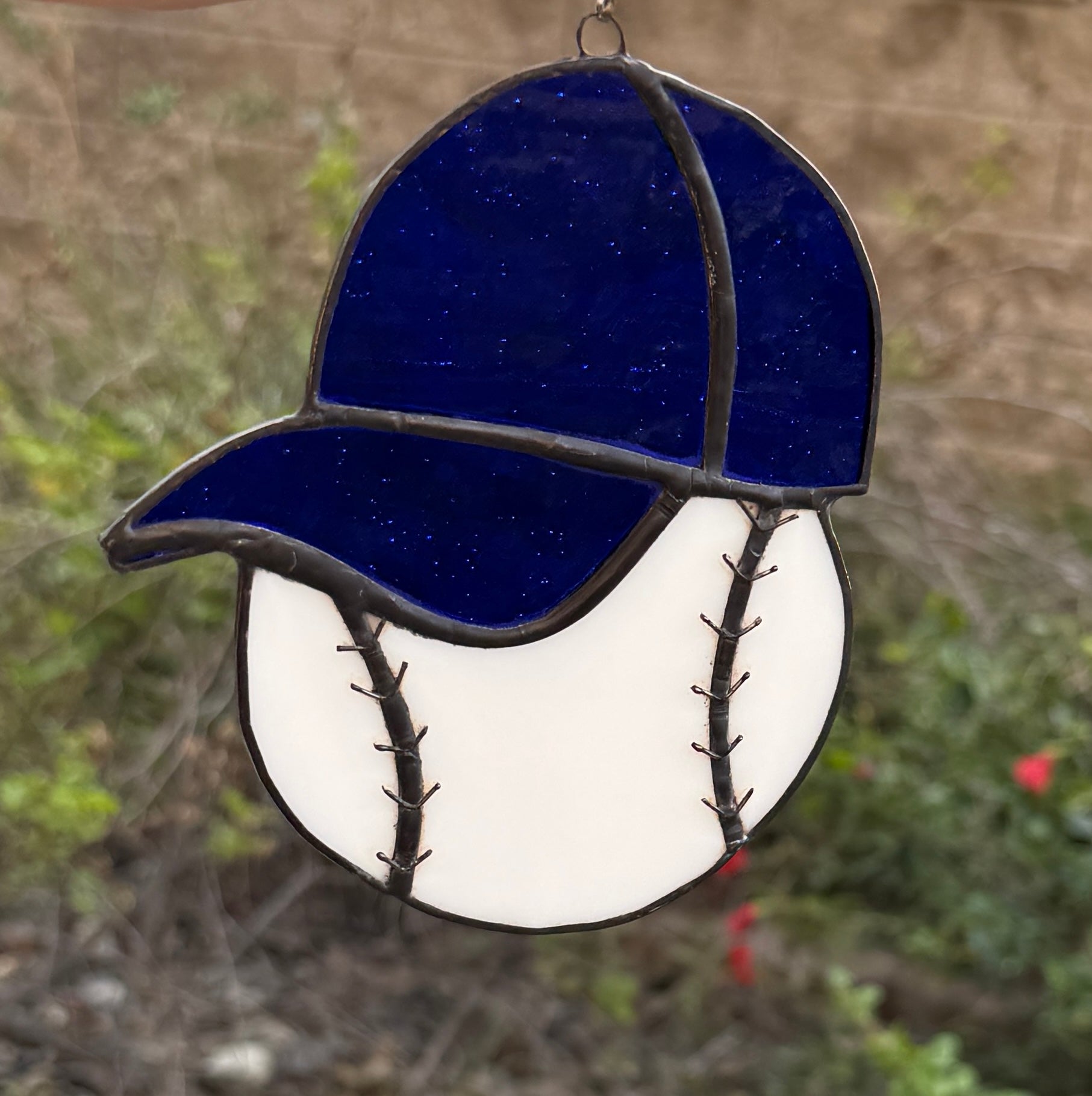 Baseball with blue hat