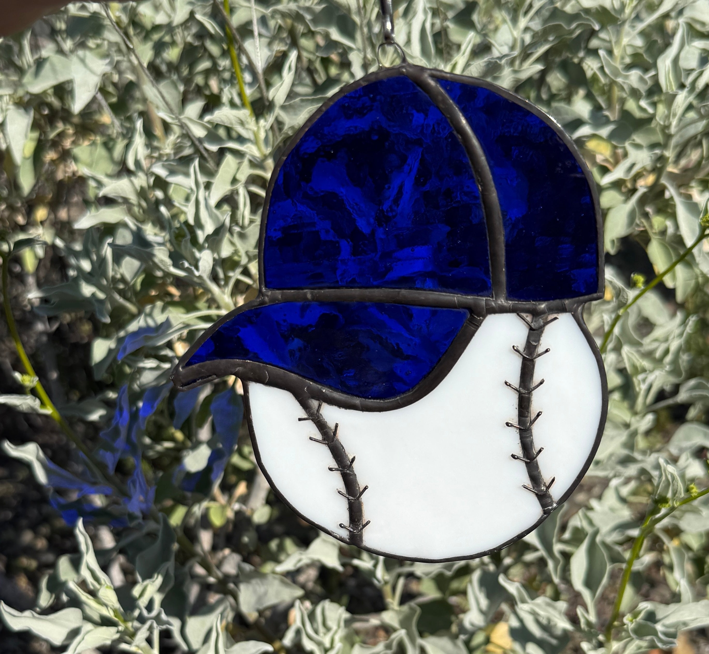 Baseball with blue hat