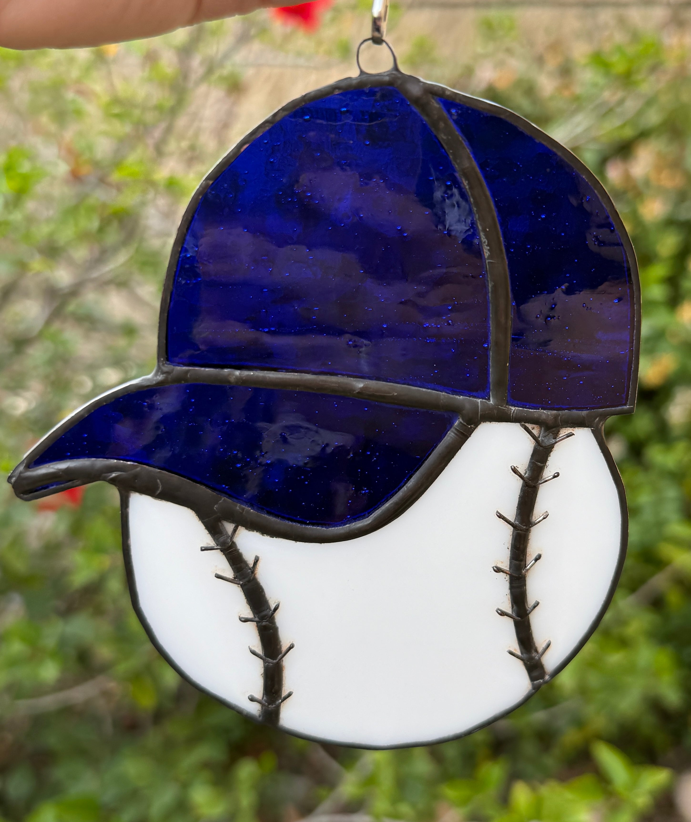 Baseball with blue hat